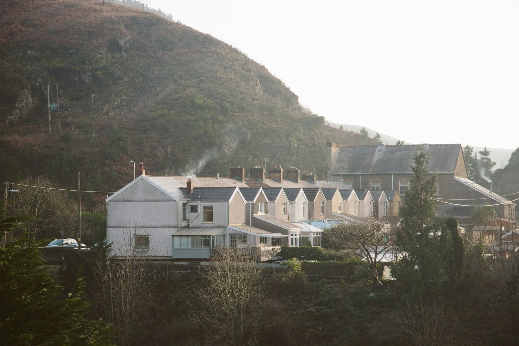 Terraced houses on a green Welsh hillside